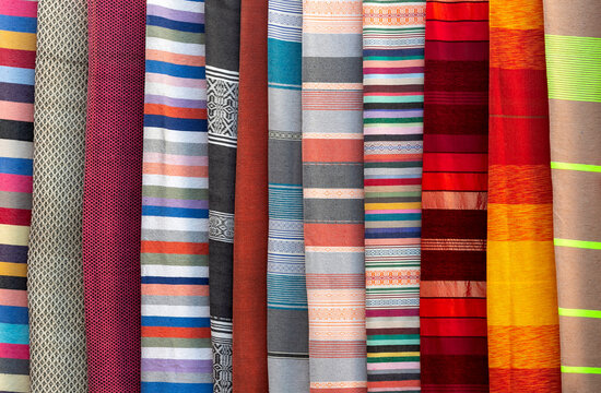 stacked colorful fabrics in the Grand Bazaar in marrakesc, Marocco