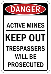 Active mine site warning sign and labels keep out, trespasser will be prosecuted