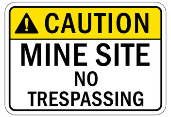 Active mine site warning sign and labels no trespassing