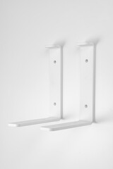 Bracket on a white background. support part for mounting shelves.