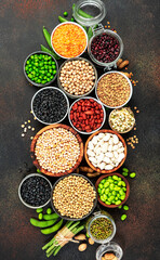 Obraz na płótnie Canvas Legumes, beans and sprouts. Dried, raw and fresh, top view. Red kidney beans, lentils, mung beans, chickpeas, soybeans, edamame, green peas, Healthy, nutritious, diet food, vegan , micronutrients 