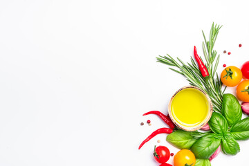 Fresh summer spicy herbs and spices for mediterranean diet. Banner. Tomato, green basil, olive oil, garlic and other. Vegan healthy food on white background. Cooking concept, top view, copy space