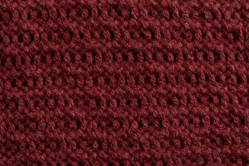 background in aubergine colored structure of a fabric