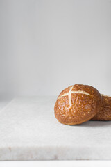 Pretzel buns on a baking sheet, German laugenbroetchen, lye buns on a baking tray