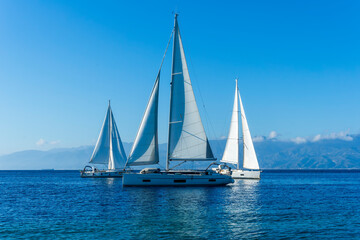 sailing yacht boats with white sails in blue sea , seascape of beautiful ships in sea gulf with...