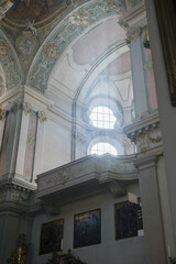 Magnificent opulent splendid Bavarian baroque church cathedral basilica interiors with stucco, murals, altar, Pilars, ceiling paintings, gold, wood domes nave