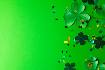 Image of green clover and copy space on green background © vectorfusionart