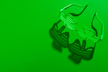 Image of green clover glasses and copy space on green background © vectorfusionart