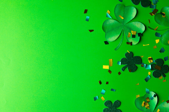 Image of green clover and copy space on green background