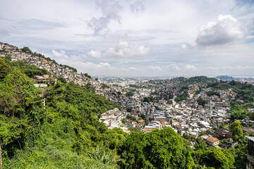 Fototapeta na wymiar Favela of Rio de Janeiro, Brazil. Colorful houses in a hill. Zona Sul of Rio.