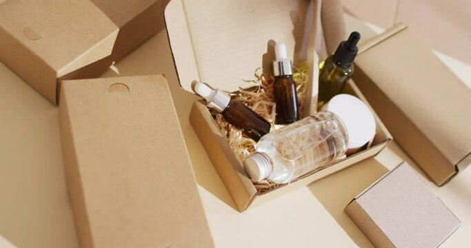 Close up of different beauty products in packages on beige background