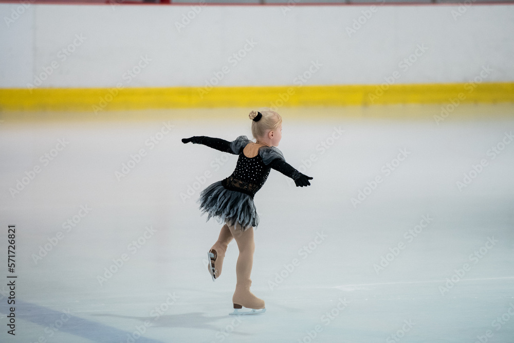 Wall mural figure skating of a little 4 year old girl. first competition. excitement, pride.