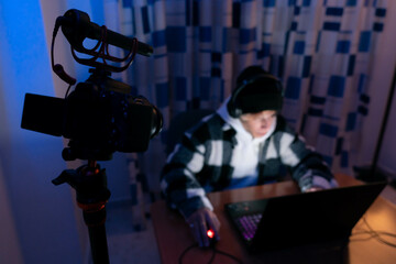 Caucasic Gamer playing and streaming games streaming camera