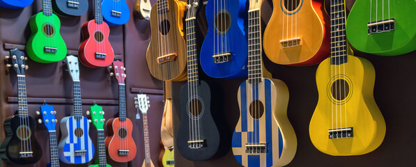 Guitars on a shelf in greece. wide horizontal 