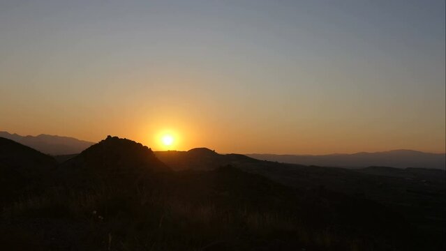 Sun setting over mountains in Almeria Province, Spain. Time lapse.
