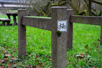 Parking lot for bicycles on green grass. Facilities for public bicycle parking for tourists and travelers.