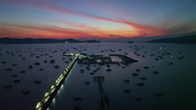 aerial view Chalong gulf in colorful of twilight. .first light above archipelago in chalong gulf Phuket thailand..4k stock footage video in travel concept.