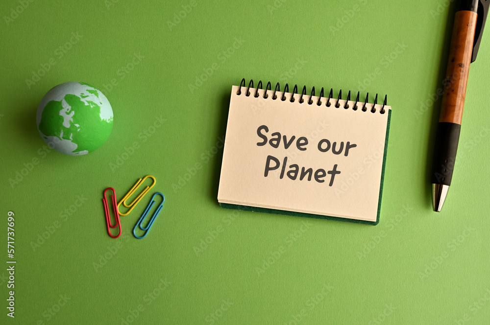 Poster there is a notebook with the word save our planet. it is eye-catching image.