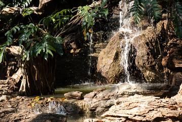 Waterfall in the garden on nature background.