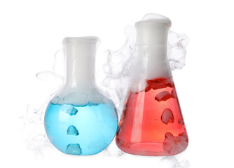 Laboratory flasks with colorful liquids and steam isolated on white. Chemical reaction