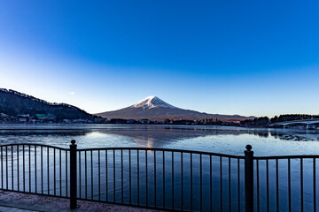 Panorama view of Mt. Fuji and Lake Kawaguchiko are frozen in January.