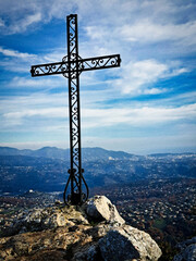 A christian cross, medium-sized mountains in the hinterland of Nice, French Riviera