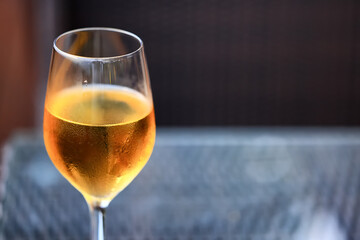 white wine tasting, chilled ice wine in a cold glass in summer
