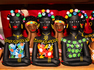 Clay and colorful dolls, typical of the Brazilian Northeast, are souvenirs for sale to tourists at...
