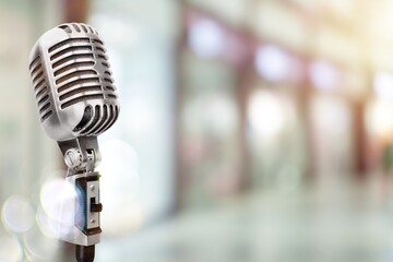 Classic retro steel microphone on background