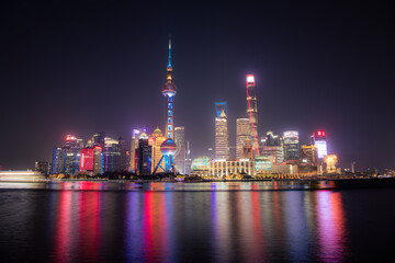 Obraz premium Shanghai Skyline, The Bund. Commercial center of the megapolis. Long exposure shot, copy space for text