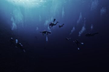 group of divers depth bubbles dive