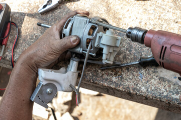 Repair of the fan at the garden table, close up