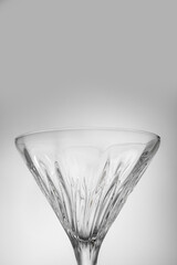 Elegant empty martini glass on grey background, closeup. Space for text