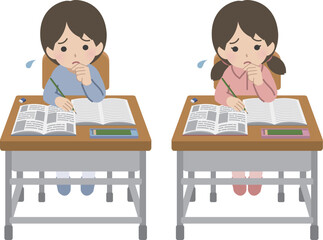 学習机に向かい困っている私服の児童