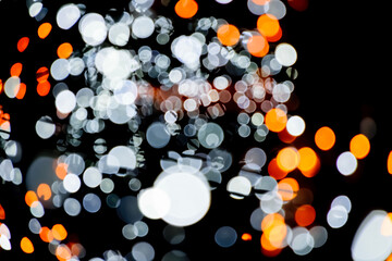 Blurred background. Christmas background with lights. Holiday light bulbs.