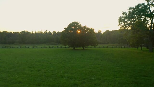 drone flying over the fence of  the Joseph Smith family farm, frame house, temple, visitors center, and the sacred grove in Palmyra New York Origin locations for the Mormons and the book of Mormon.