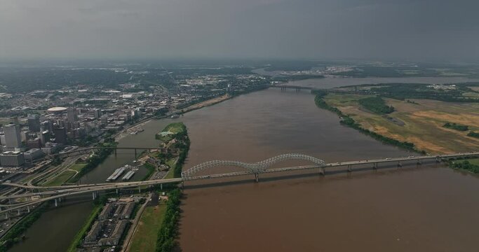 Memphis Tennessee Aerial v34 high angle view flyover mississippi river, panning from arkansas towards downtown capturing hernando de soto bridge and urban cityscape - Shot with Mavic 3 Cine - May 2022