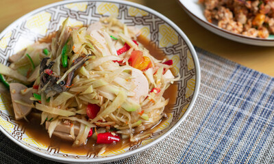 papaya salad with crab and fermented fish with pork sausage,Spicy thai food