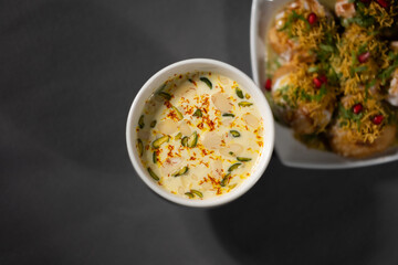 Almond-infused milk (‘badam milk’ or ‘badam doodh’), a traditional Ayurvedic recipe, served with saffron, pistachio, and almond slices.