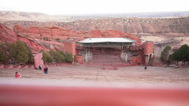 Red Rocks Park Amphitheater venue in Colorado. Tourists on steps.