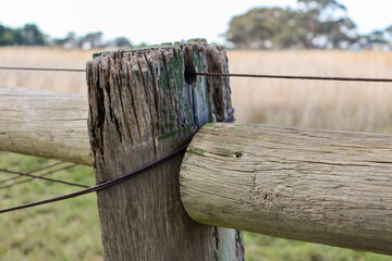 old wooden post and wire fence