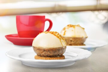 Tasty fresh bun in and cup of coffee