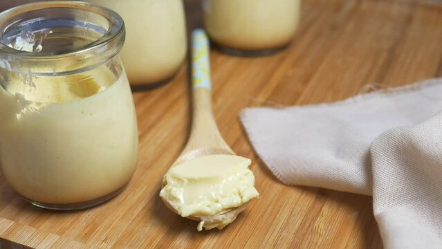  Caramel pudding in a glass jar on table 