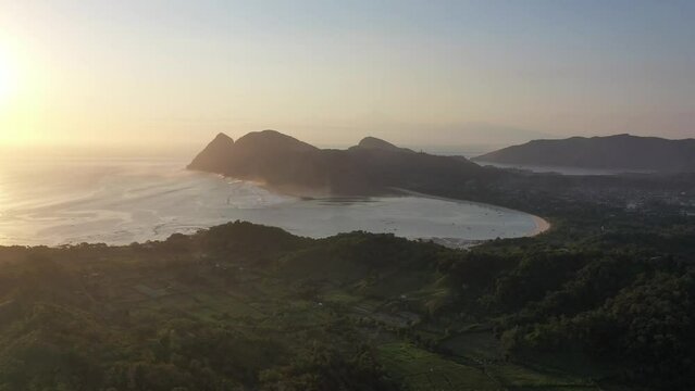 Drone shot over Sumbawa's jungle and mountains.