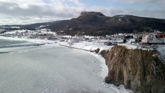 drone shot of Percé village during winter.