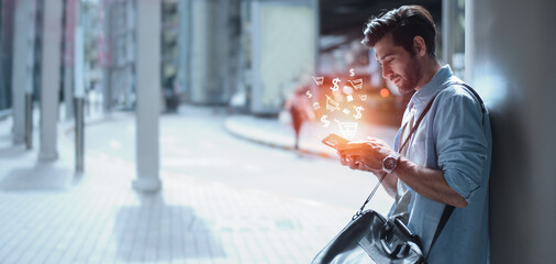 young adult man using mobile smartphone in hand paying online and shopping on virtual global...