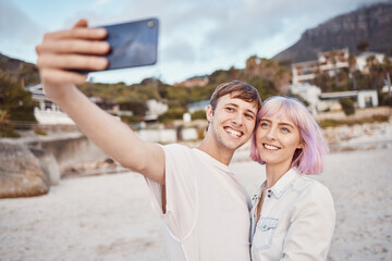 Selfie, love and couple on the beach for a date, travel memory and quality time in Bali. Freedom, care and happy man and woman taking a photo while walking by the ocean during a vacation together