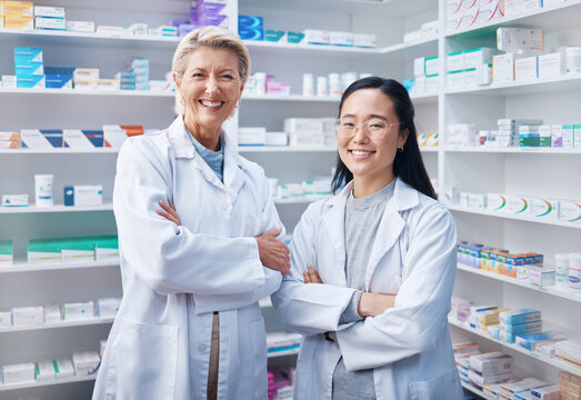 Portrait, women teamwork and pharmacists with arms crossed in pharmacy, drugstore or shop. Healthcare, medication store and happy, proud or confident medical doctors, senior woman and Asian female. - Powered by Adobe