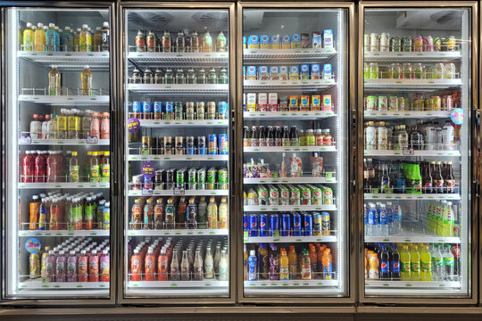 PENANG, MALAYSIA - 15 FEB 2023: Huge fridge with various choice beverages in CU Convenience Store. CU is a South Korean convenience store chain that is operated and owned by BGF Retail.