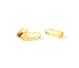 Primrose oil capsules on white background.